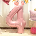 Detail of 40-inch pearlescent pink number 4 balloon for a kid's birthday party setting - Number 4