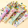 Sparacoriandoli autogonfiabili in quattro colori con vivaci paillettes metalliche - Grande