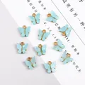 Pendentifs papillon bleu clair avec base en métal doré pour la création de bijoux DIY - Lot de 4 / Rose bonbon