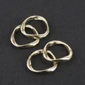 Set of four wavy gold alloy round pendants for DIY jewelry and earring making - Set of 4 / Approximately 20mm / Gold