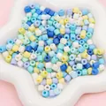 Bunte 6mm Glas-Trommelperlen in Blau und Gelb auf einem sternförmigen Keramiktablett - 6x6mm (10g/ca. 30 Stk.) / Blau-Serie