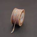 Handwoven orange and blue spiral pattern cotton thread cord on a craft spool - 1.0mm/25m / Tangerine