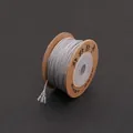 Deep gray twisted cotton cord on a brown circular cardboard spool for DIY jewelry making - Silver Gray