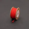 Hand-woven red Chinese knot cord on a craft paper spool for DIY jewelry making - Red
