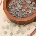 Icy blue and white frosted acrylic flower beads with gold accents for DIY jewelry - Approx 6x3mm, Hole 1mm, 10g/Pack (Approx 110 Pcs) / Light Gray and White