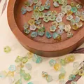 Frosted acrylic flower beads with gold splatter detail in assorted soft pastel colors - Approx 6x3mm, Hole 1mm, 10g/Pack (Approx 110 Pcs) / Blue and Yellow Green