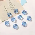 Cuentas de trébol en vidrio azul claro translúcido para joyería DIY con agujeros - 10 Piezas/Paquete (13mm) / Aguamarina