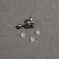 Silver flower earring stud with sparkling gems and four clear silicone backings - Diameter Three