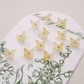 Set of 12 pale yellow butterfly charms with shimmer finish and gold center beads - 10x11mm (5 Pieces/Pack) / Yellow Blue Tears Effect