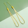 Set van twee felgele gevlochten lanyards voor telefoons en sleutelhangers op groene basis - 10 strengen pakket / Geel