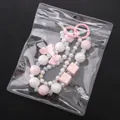 Pink bow and checkered bead phone strap in a clear PVC self-sealing bag with hanging hole - Oversized Style