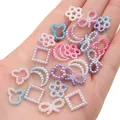 Macro shot of colorful gradient pearl charms in star, moon, and bear shapes for DIY crafts - Mixed Shapes (Artificial Pearl) / 20g Pack (Approx. 190 Pcs) / Purple-Blue Gradient