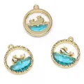 Drie goudkleurige walvishangers met lichtblauw glas voor doe-het-zelf sieraden - Walvis / 16x18mm / Goud Blauw Glas