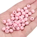 Perline tonde in legno rosa da 8mm per gioielli fai da te tenute in mano - 8mm (Foro Circa 2mm) / 50 Pezzi / Rosa Chiaro