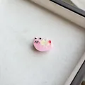 Macro shot of pink resin snail hair clip with colorful shell and cute smiling face details - Pink Snail
