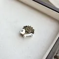 Detailed macro shot of a cute hedgehog resin hair clip with tortoiseshell pattern finish - Grey Hedgehog