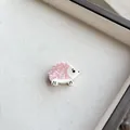 Detail of pink resin hedgehog hair clip in a beige fabric jewelry display box - Pink Hedgehog