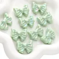 Set of ten mint green iridescent bow-shaped resin beads with a pearlescent finish - Heart Shape / Pack of 2 (28x22mm) / Green