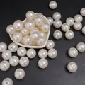 Perle rotonde bianco crema lucide in una ciotola a cuore per la creazione di gioielli DIY - Perline rotonde / 18mm (10 Pezzi/Confezione) / Beige