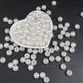 Perle bianche sfuse in ABS in una ciotola a cuore per la creazione di gioielli fai da te - Perline rotonde / 10mm (100 Pezzi/Confezione) / Bianco