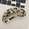 Large acetate hair claw clip featuring classic cream tortoiseshell pattern and cutout design - 9.5*4.5cm / Light Tortoiseshell