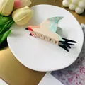 Acetate blue swallow bird hair claw clip for women on a decorative ceramic tray - Green Swallow