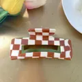 Detail of red-brown checkered hair claw with olive green interior and sturdy grip - Rectangle Hollow Claw / Reddish Brown Checkered with Olive Green