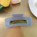 Detail of lavender and olive green checkered hair claw clip on a golden tray - Rectangle Hollow Claw / Light Purple with Olive Green