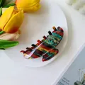 Artistic acetate hair claw clip with colorful marble texture on white ceramic plate - Large / Ink Striped