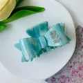 Blue marble acetate hair claw clip in bow shape with sparkling rhinestone accents - Blue Water Ripple
