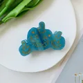 Close-up of blue marble texture Halloween pumpkin hair claw clip with golden face pattern - Lake Blue 3-Pumpkin