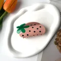 Pink strawberry hair claw clip with green leaves on a white decorative tray - Large / Pink Strawberry