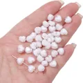 Acrylic macaron two-tone heart beads for DIY jewelry making held in hand for scale - White White Center