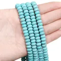 Hand holding turquoise rondelle spacer beads with natural brown web pattern for DIY jewelry - Abacus Beads / 4x8mm (Approx. 78 Pcs) / Sky Blue