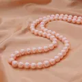 Strand of round pink glass imitation pearls on elegant champagne silk background - 8mm (30 Pcs/Pack) / Pink