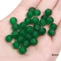 Handheld view of 8mm green translucent round glass beads for DIY jewelry making - Transparent Jelly Round Bead / 8mm / Green