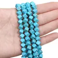Hand holding synthetic blue turquoise cube beads with brown natural vein patterns - Cube Bead Style / 8x8mm (38cm/pack approx. 52 beads) / Sky Blue