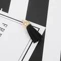 DIY jewelry charm featuring black faux suede tassel with a polished gold metal cap head - Black
