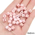 Pink cube ceramic beads 6x6mm for DIY jewelry making shown in hand for scale - Cube / 5 Pieces/Pack (6x6mm, Hole Approx. 2mm) / Pink