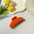 Vibrant orange acetate hair claw clip with glossy finish for elegant French updos - Orange