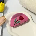 Vibrant bright pink tulip flower hair claw clip displayed on a wavy white tray - Pink Tulip