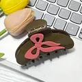 Dark brown acetic acid hair claw clip with a pink ribbon bow accent for women - Brown
