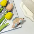 Pinza per capelli a forma di dinosauro in acetato rosa marmo con pinne blu - Rosa