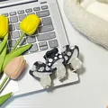 Three cute mushroom acetate hair claws in black and white polka dots with bow detail - Black