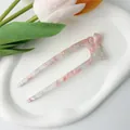 Detail of U-shaped hair pin with marble patterned acetate and ribbon bow decoration - Floral Pink