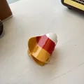 Close-up of candy corn acrylic hair claw with white, orange and yellow polished layers - Candy Corn Style