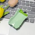 Cute green pepper acetate hair claw clip with glossy finish on a laptop keyboard - Green Apple