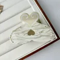 Pinza per capelli a cuore con strass e texture marmorizzata in acetato da donna - Grande / Bianco