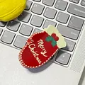Support de téléphone moufle rouge de Noël avec texte Merry Christmas sur clavier - Gants