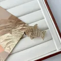 Detailed view of a mini whale shark hair claw clip made of brown acetate fiber material - Mini Khaki Shark
